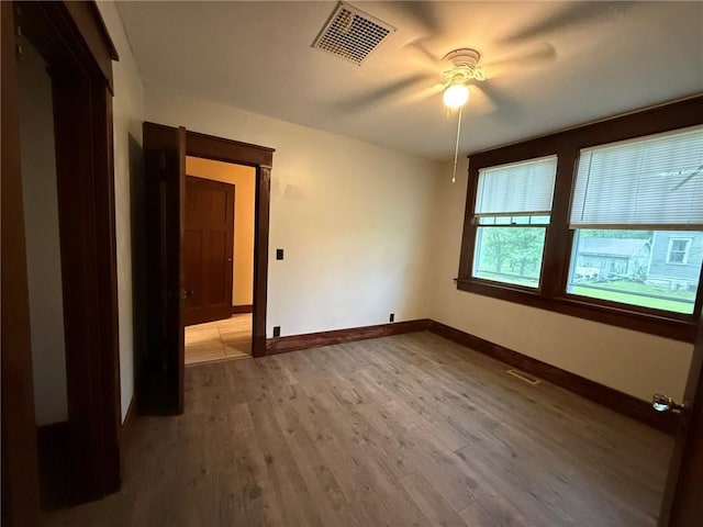 347 Walnut St, Kidder, MO 64649 - spare room with baseboards, ceiling fan, and wood finished floors