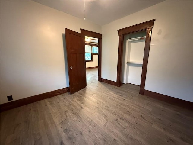 347 Walnut St, Kidder, MO 64649 - empty room with baseboards and wood finished floors