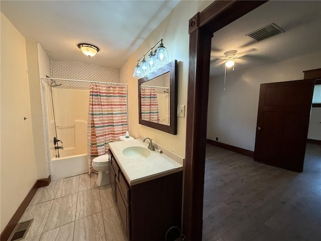 347 Walnut St, Kidder, MO 64649 - full bathroom with vanity, toilet, shower / tub combo, ceiling fan, and baseboards