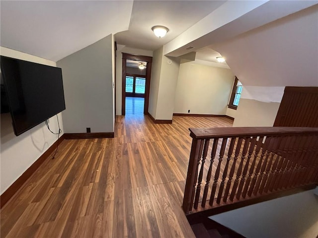 347 Walnut St, Kidder, MO 64649 - additional living space featuring wood finished floors, baseboards, and vaulted ceiling