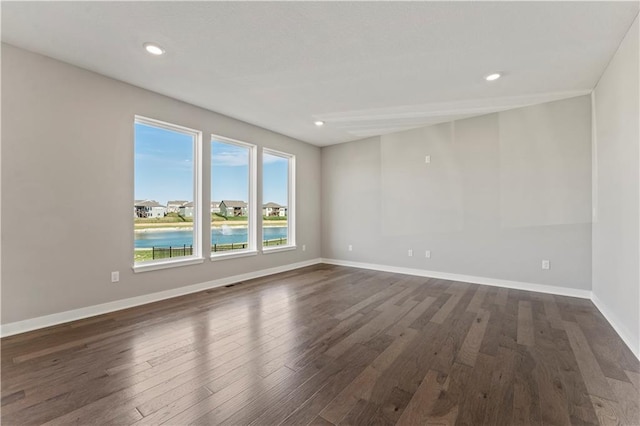 18232 W 166th St, Olathe, KS 66062 - unfurnished room with dark wood-style flooring, baseboards, and recessed lighting