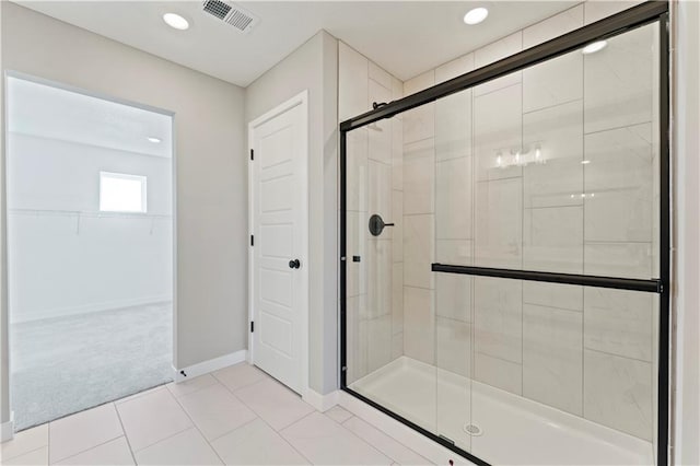 18232 W 166th St, Olathe, KS 66062 - bathroom featuring a shower stall, a spacious closet, baseboards, tile patterned floors, and recessed lighting