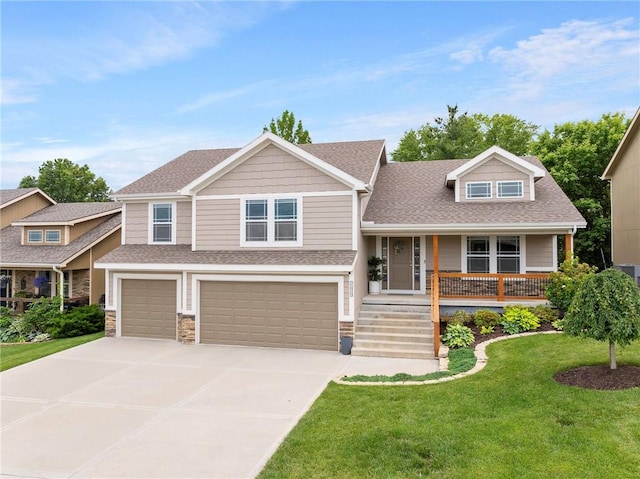 21419 W 47th Ter, Shawnee, KS 66218 - view of front of house featuring an attached garage, a porch, a front yard, driveway, and a shingled roof