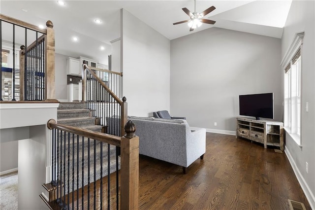 21419 W 47th Ter, Shawnee, KS 66218 - living room featuring a ceiling fan, dark wood-style floors, stairway, vaulted ceiling, and baseboards
