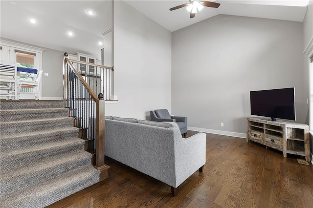 21419 W 47th Ter, Shawnee, KS 66218 - living room featuring a ceiling fan, vaulted ceiling, stairway, dark wood-style flooring, and baseboards