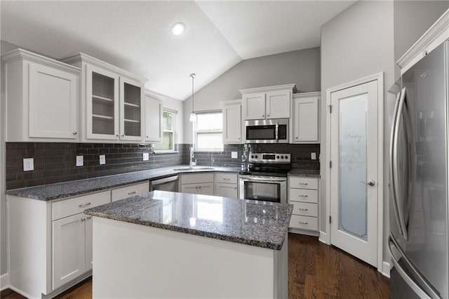 21419 W 47th Ter, Shawnee, KS 66218 - kitchen featuring appliances with stainless steel finishes, a sink, vaulted ceiling, white cabinets, and dark wood finished floors