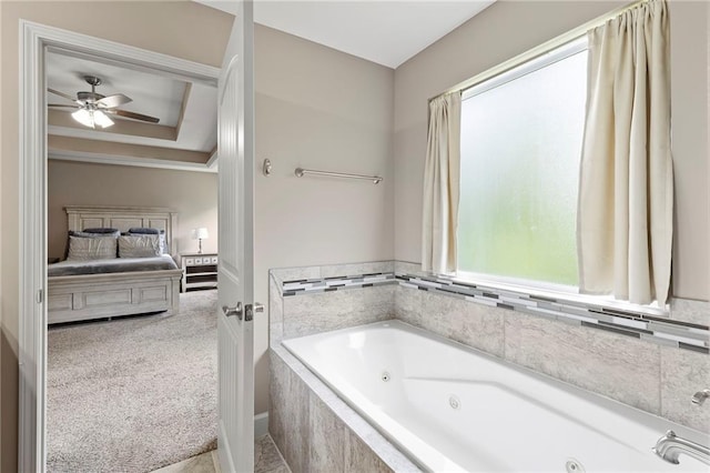 21419 W 47th Ter, Shawnee, KS 66218 - bathroom with ensuite bath, a jetted tub, ceiling fan, a raised ceiling, and ornamental molding