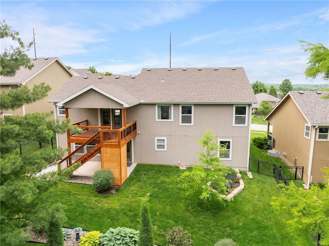 21419 W 47th Ter, Shawnee, KS 66218 - back of property with a shingled roof, stairs, and a deck