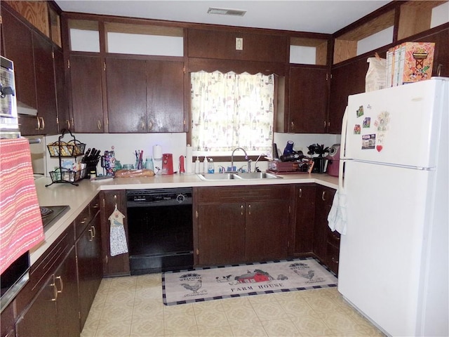 4426 Shrine Park Rd, Leavenworth, KS 66048 - kitchen featuring freestanding refrigerator, dishwasher, a sink, light countertops, and light floors