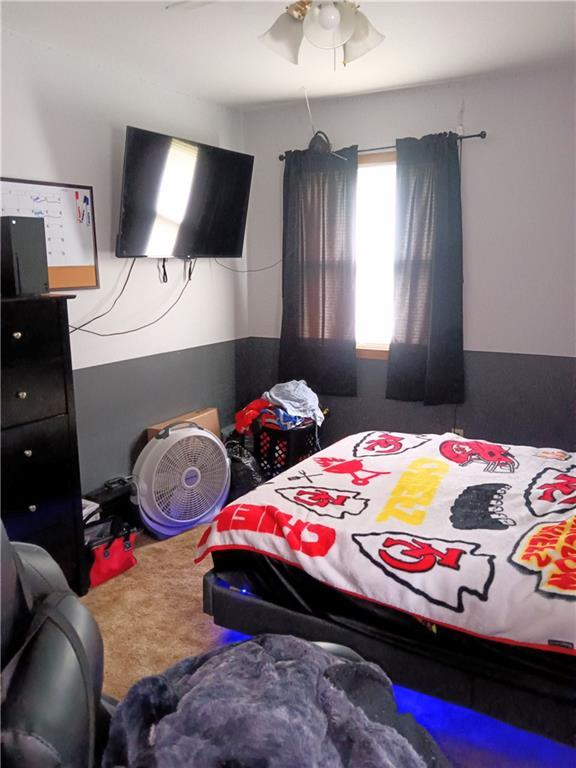 4426 Shrine Park Rd, Leavenworth, KS 66048 - carpeted bedroom featuring ceiling fan