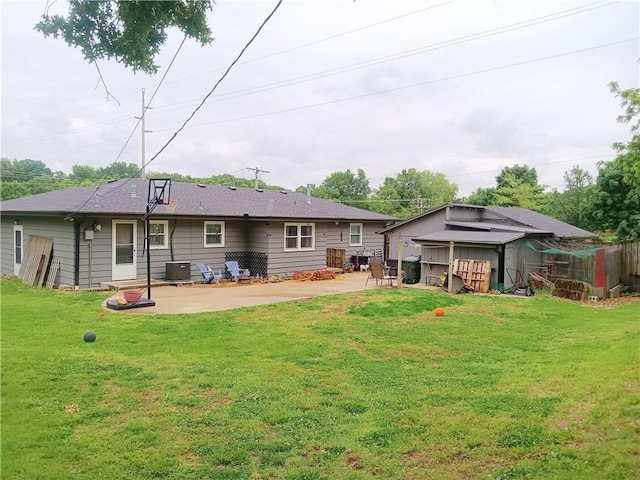 4426 Shrine Park Rd, Leavenworth, KS 66048 - rear view of house featuring a patio, central air condition unit, and a yard