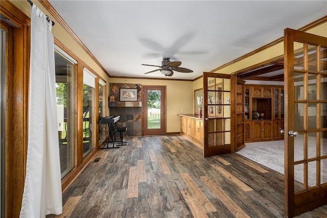 19819 Mclouth Rd, Tonganoxie, KS 66086 - office with french doors, crown molding, dark wood finished floors, a ceiling fan, and baseboards