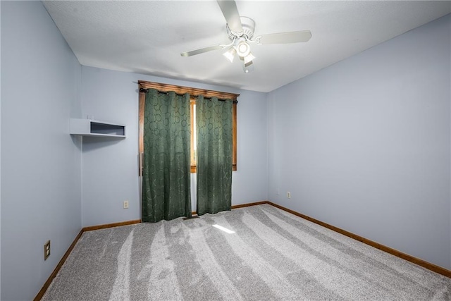 19819 Mclouth Rd, Tonganoxie, KS 66086 - carpeted spare room with baseboards and a ceiling fan