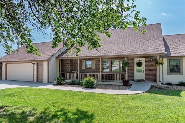 19819 Mclouth Rd, Tonganoxie, KS 66086 - view of front facade featuring covered porch, a garage, a front lawn, concrete driveway, and roof with shingles