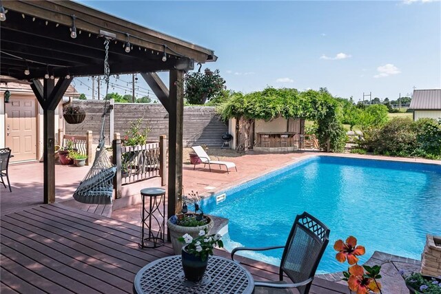 19819 Mclouth Rd, Tonganoxie, KS 66086 - view of pool featuring a wooden deck and a patio