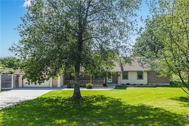 19819 Mclouth Rd, Tonganoxie, KS 66086 - view of front of home featuring concrete driveway, a garage, and a front yard