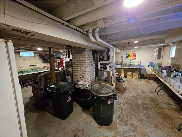 8708 Independence Ave, Kansas City, MO 64125 - basement featuring a workshop area and water heater