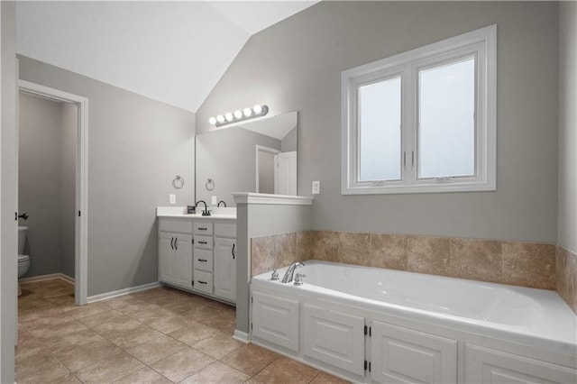 10154 N Lane Dr, Kansas City, MO 64157 - full bathroom featuring vanity, a bath, toilet, lofted ceiling, and tile patterned flooring
