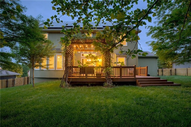 10154 N Lane Dr, Kansas City, MO 64157 - rear view of property featuring a deck and roof mounted solar panels