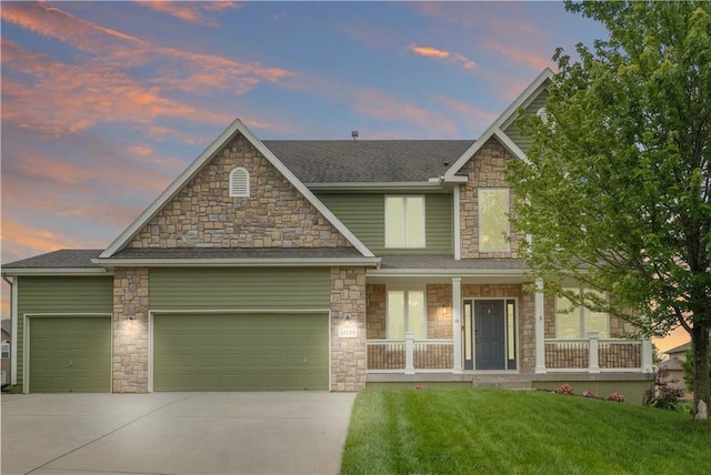 10154 N Lane Dr, Kansas City, MO 64157 - craftsman-style home with an attached garage, concrete driveway, stone siding, a porch, and a yard