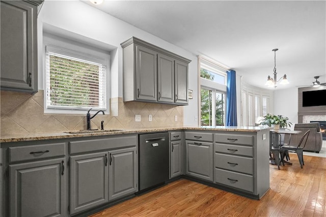10154 N Lane Dr, Kansas City, MO 64157 - kitchen with gray cabinets, dishwasher, a sink, a chandelier, and light wood finished floors