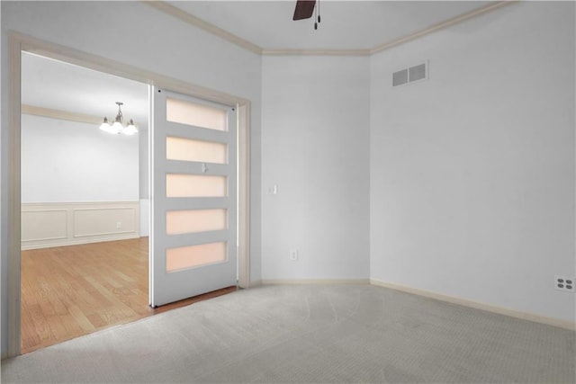 10154 N Lane Dr, Kansas City, MO 64157 - empty room with crown molding, ceiling fan, a chandelier, wood finished floors, and wainscoting