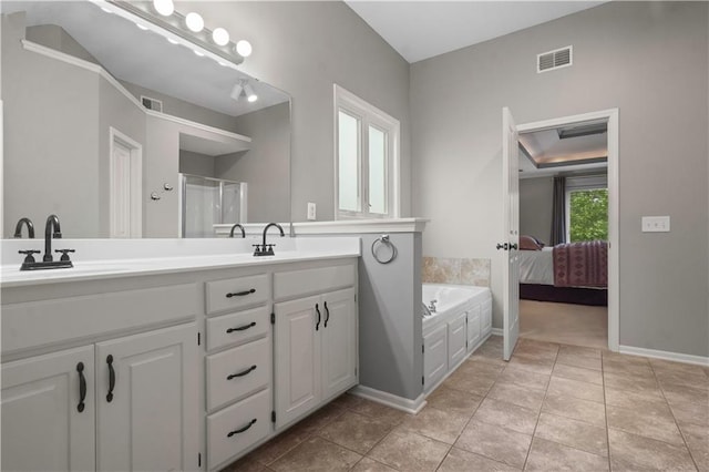 10154 N Lane Dr, Kansas City, MO 64157 - bathroom featuring double vanity, a bath, tile patterned floors, and baseboards