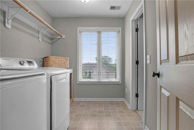10154 N Lane Dr, Kansas City, MO 64157 - laundry room featuring washing machine and dryer and baseboards