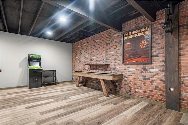 10154 N Lane Dr, Kansas City, MO 64157 - rec room featuring wood finished floors and brick wall