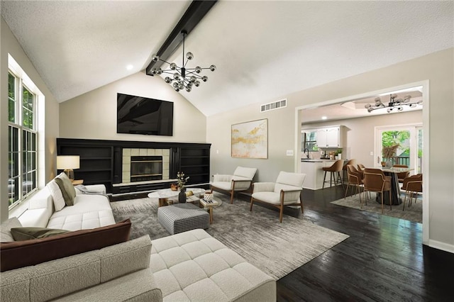 1609 NE Jade Ct, Lees Summit, MO 64086 - living area featuring dark wood-style flooring, plenty of natural light, a fireplace, and baseboards
