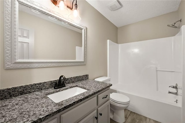 1609 NE Jade Ct, Lees Summit, MO 64086 - bathroom featuring vanity, toilet, a textured ceiling, bathtub / shower combination, and tile patterned floors