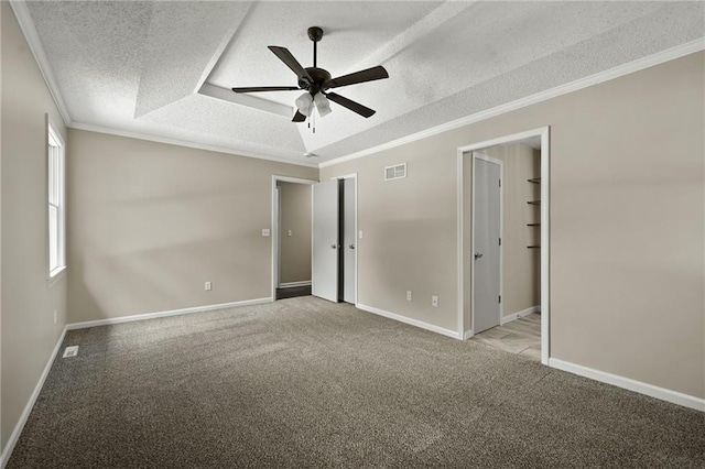 1609 NE Jade Ct, Lees Summit, MO 64086 - unfurnished bedroom with a textured ceiling, carpet flooring, baseboards, and ornamental molding