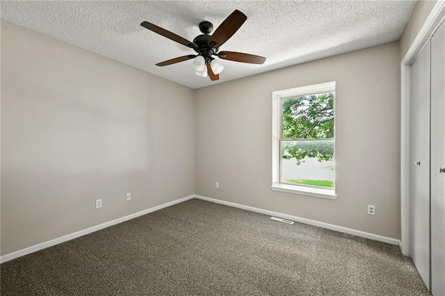 1609 NE Jade Ct, Lees Summit, MO 64086 - carpeted spare room with ceiling fan, baseboards, and a textured ceiling