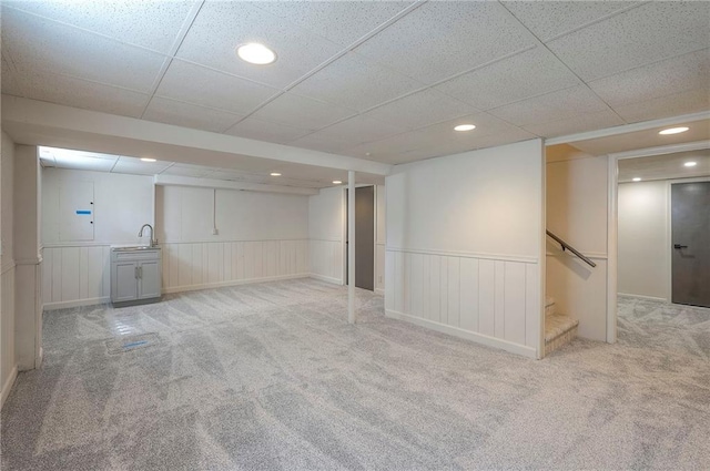 9100 Dearborn St, Overland Park, KS 66207 - finished basement with carpet floors, wainscoting, stairway, and recessed lighting