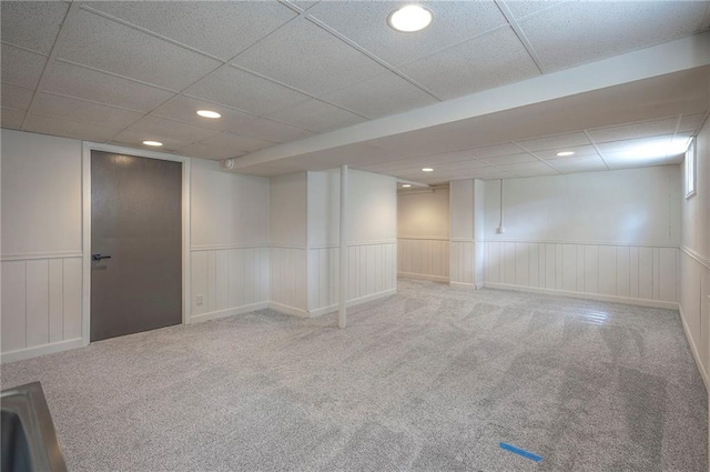 9100 Dearborn St, Overland Park, KS 66207 - finished basement featuring a drop ceiling, carpet, wainscoting, recessed lighting, and a decorative wall
