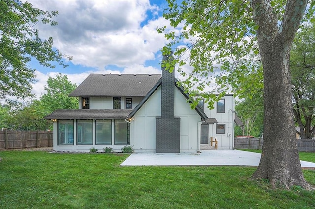 9100 Dearborn St, Overland Park, KS 66207 - rear view of house with a chimney, a patio, and roof with shingles