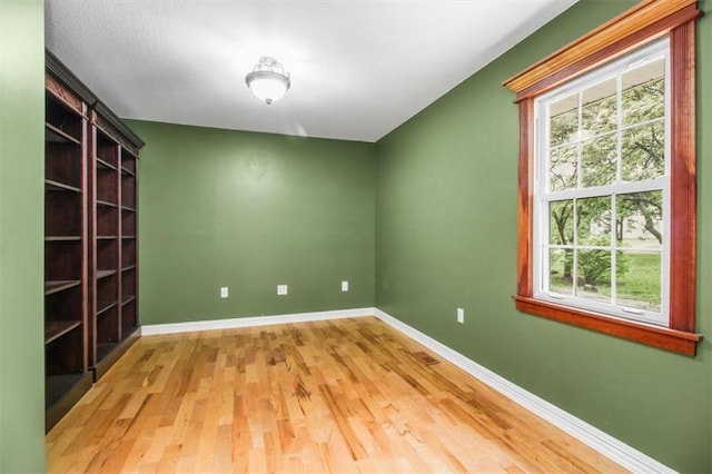 4188 Country Squire Ln, Oak Grove, MO 64075 - unfurnished room featuring wood finished floors and baseboards