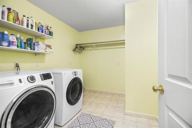 4188 Country Squire Ln, Oak Grove, MO 64075 - laundry room with washing machine and clothes dryer, baseboards, and light tile patterned flooring