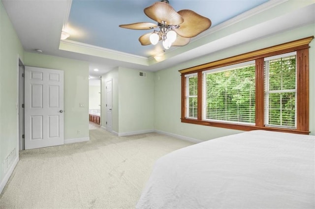 4188 Country Squire Ln, Oak Grove, MO 64075 - carpeted bedroom featuring ornamental molding, a raised ceiling, baseboards, ensuite bath, and a ceiling fan