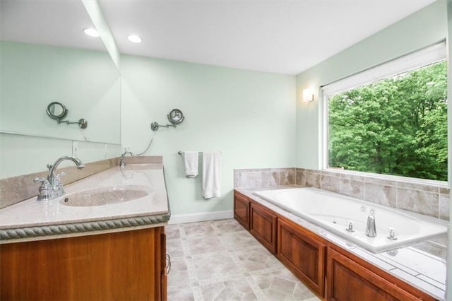 4188 Country Squire Ln, Oak Grove, MO 64075 - full bath featuring double vanity, a jetted tub, and baseboards