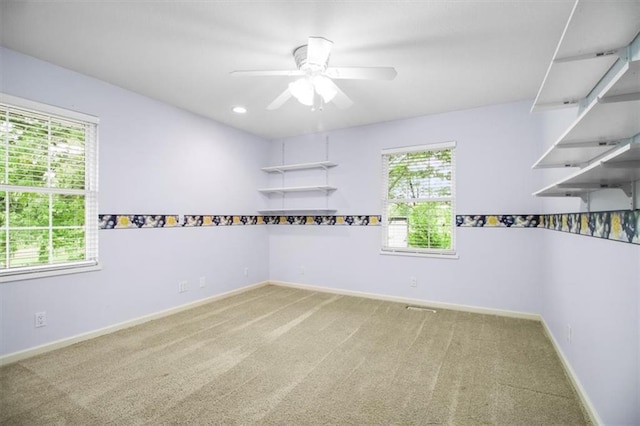 4188 Country Squire Ln, Oak Grove, MO 64075 - carpeted spare room with plenty of natural light, ceiling fan, baseboards, and recessed lighting