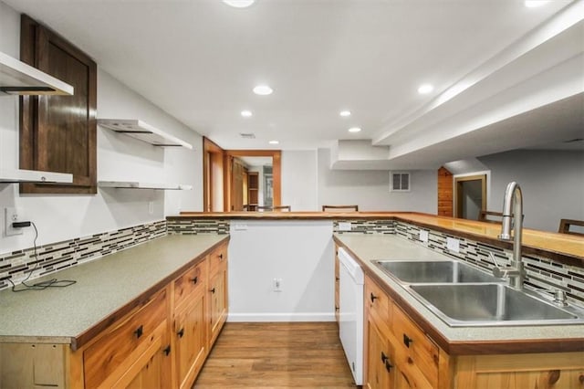 4188 Country Squire Ln, Oak Grove, MO 64075 - kitchen with a sink, white dishwasher, light wood-style flooring, recessed lighting, and decorative backsplash