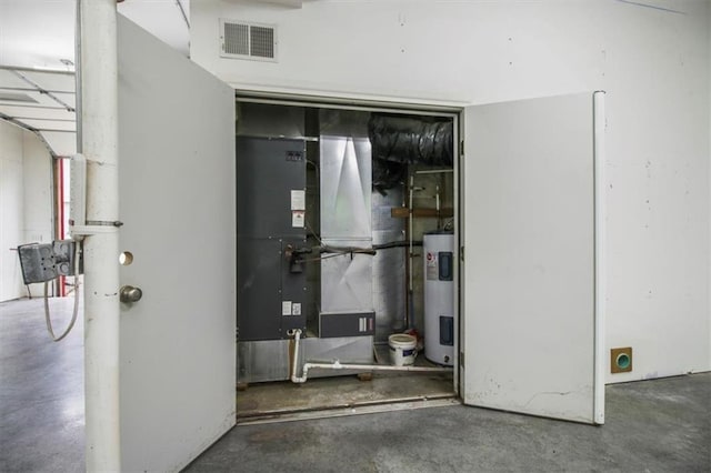 4188 Country Squire Ln, Oak Grove, MO 64075 - interior space featuring water heater and heating unit