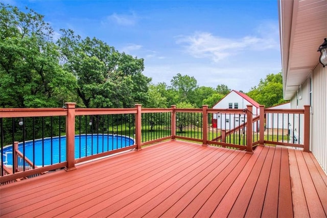 4188 Country Squire Ln, Oak Grove, MO 64075 - deck with an outbuilding and view of wooded area