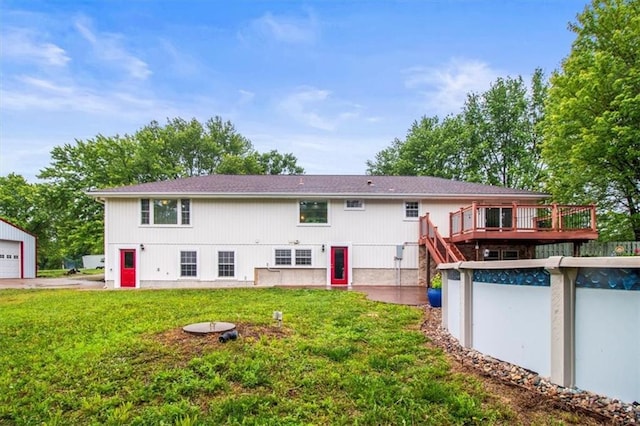4188 Country Squire Ln, Oak Grove, MO 64075 - rear view of property featuring a wooden deck, a lawn, and an outdoor pool