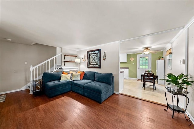 4400 Elledge Dr, Roeland Park, KS 66205 - living area with light wood-style flooring, baseboards, stairway, crown molding, and ceiling fan
