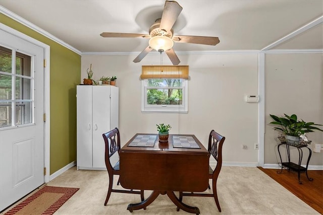4400 Elledge Dr, Roeland Park, KS 66205 - dining area featuring crown molding, baseboards, a ceiling fan, and light wood finished floors