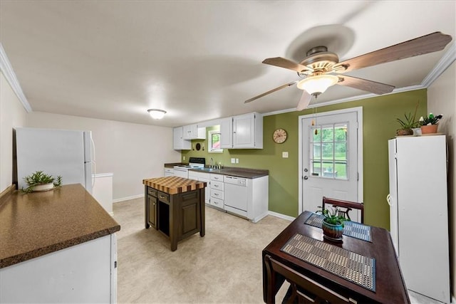 4400 Elledge Dr, Roeland Park, KS 66205 - kitchen featuring white appliances, crown molding, a sink, white cabinets, and a ceiling fan
