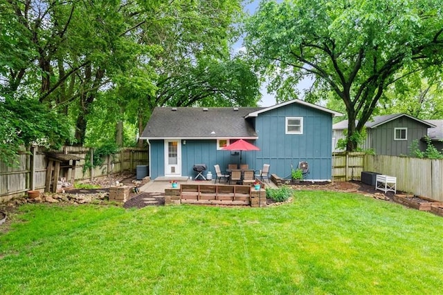 4400 Elledge Dr, Roeland Park, KS 66205 - rear view of house featuring board and batten siding, roof with shingles, and a patio area