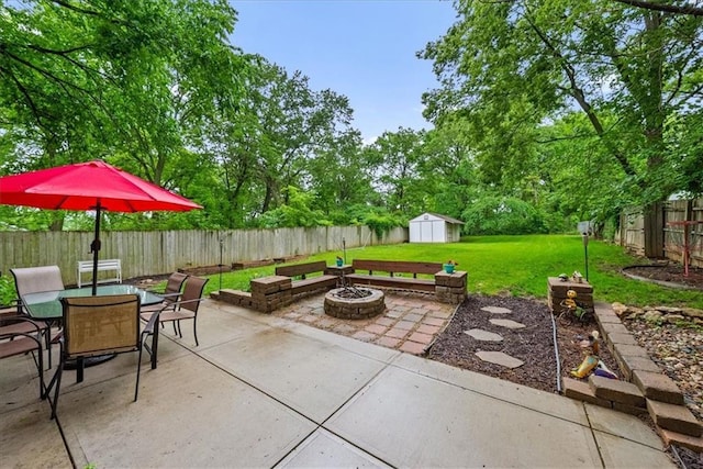 4400 Elledge Dr, Roeland Park, KS 66205 - view of patio with a fire pit, outdoor dining area, and view of wooded area
